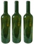 Three empty green wine bottles