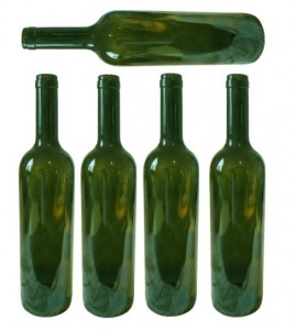 Five empty green wine bottles